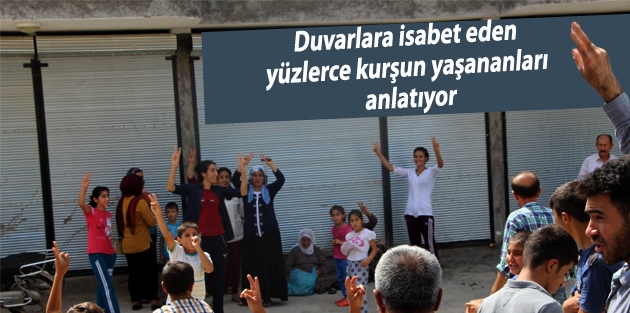 Duvarlara isabet eden yüzlerce kurşun yaşananları anlatıyor